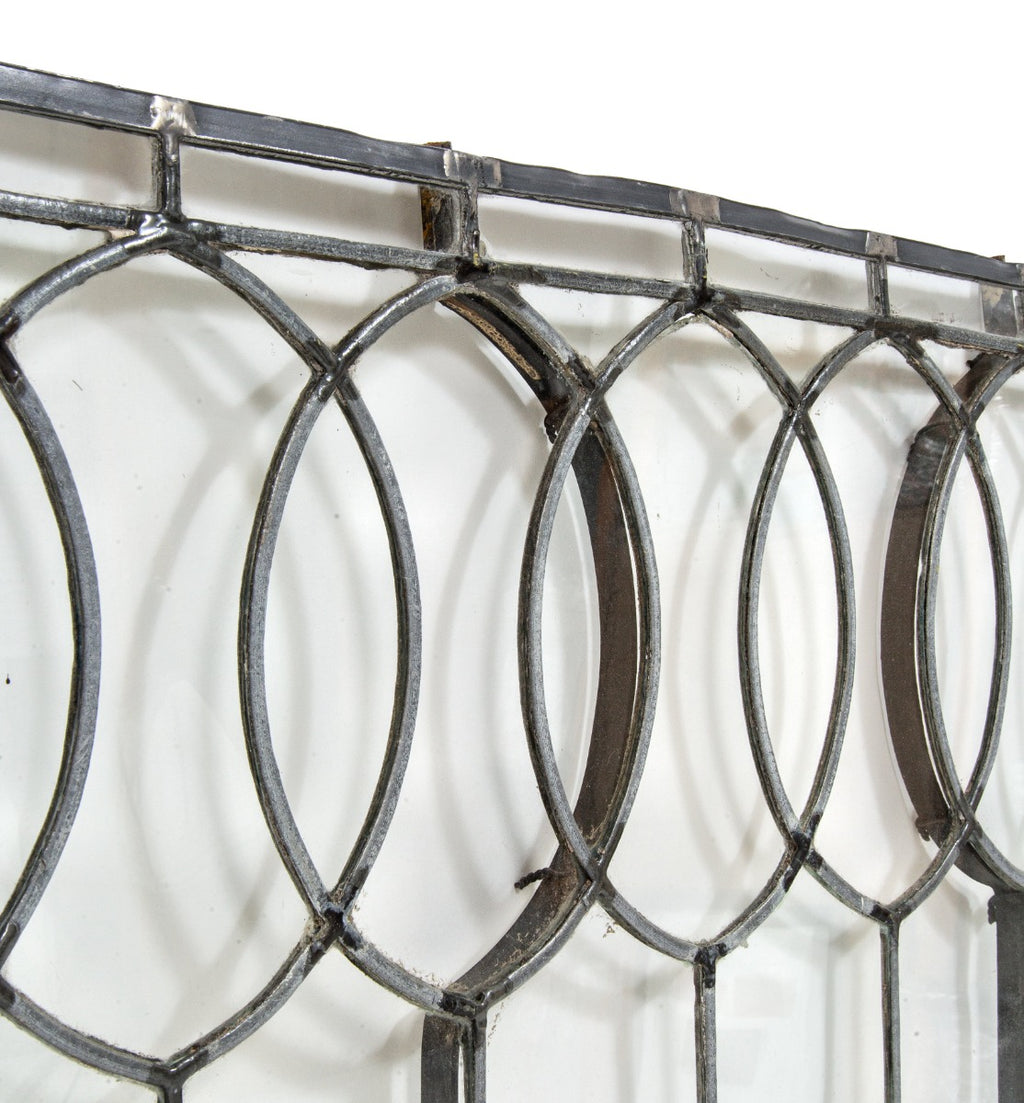 important late 19th century strongly geometric leaded clear glass robert p. parker "bootleg" house window featuring bands of overlapping ovals