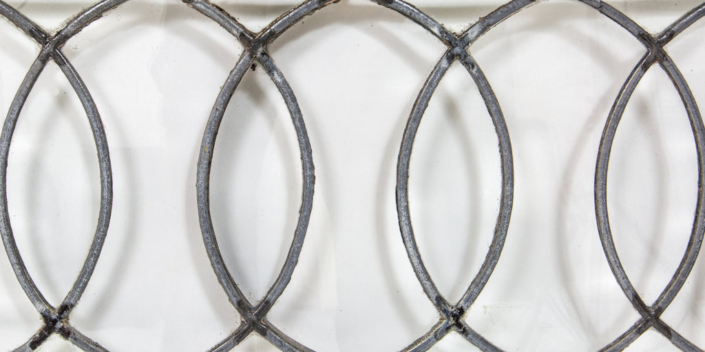 important late 19th century strongly geometric leaded clear glass robert p. parker "bootleg" house window featuring bands of overlapping ovals