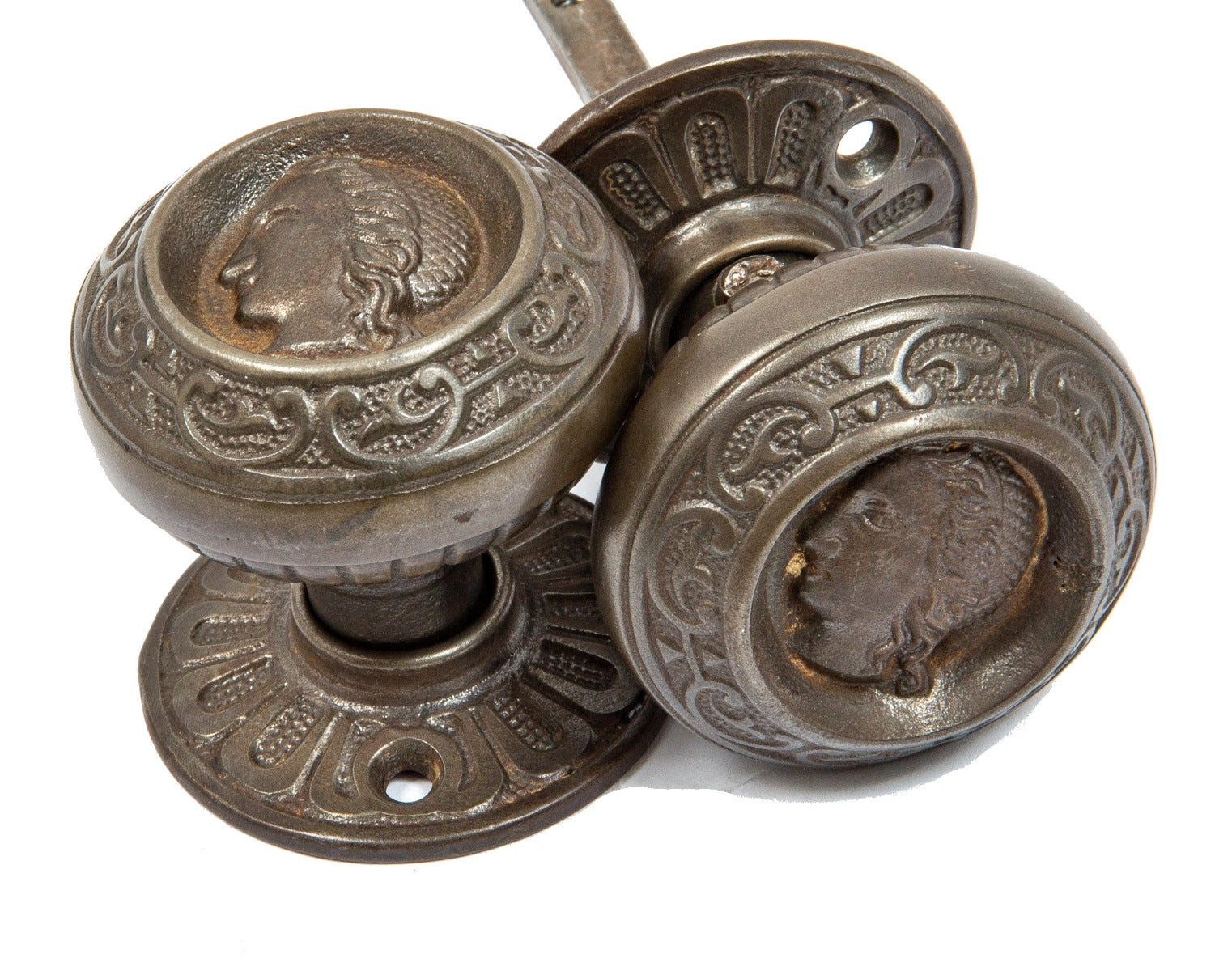 pair of original 1870s figural cast iron interior residential "clara burton" doorknobs with matching rosettes