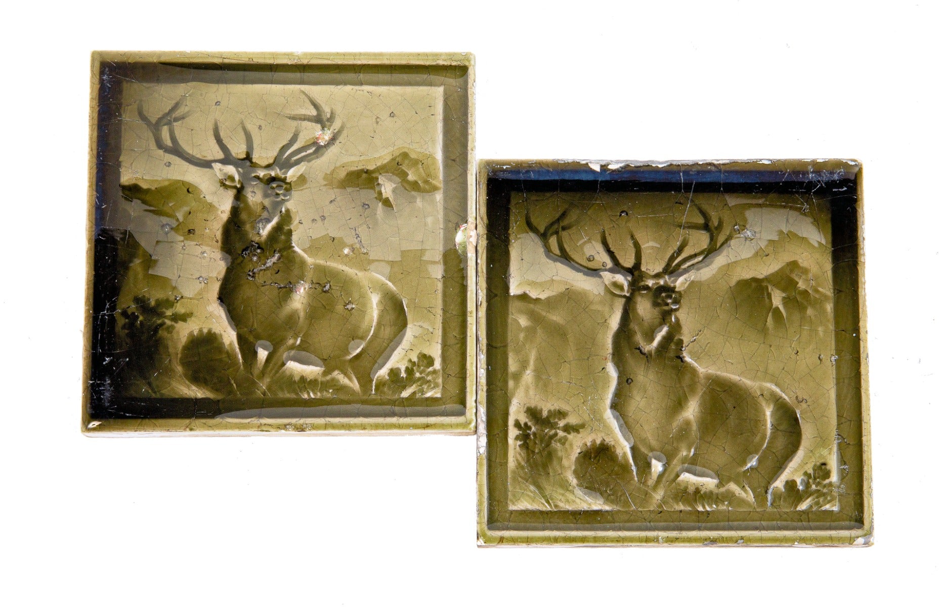 two matching original 19th century dust-pressed intaglio green figural fireplace tiles from salvaged chicago residence