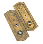 two matching original early 20th century custom-designed chicago dearborn hotel guest room doorknob backplates
