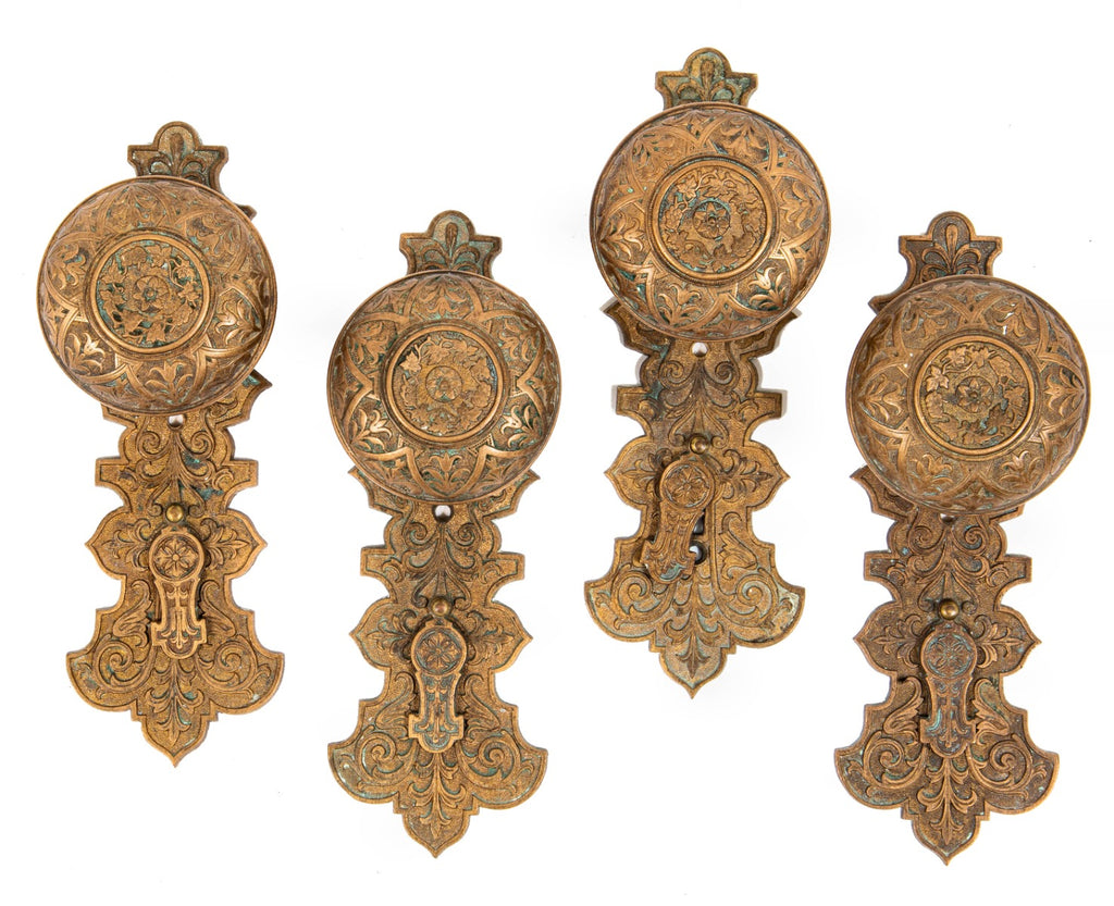 lot of original well-maintained ornamental cast bronze mccc/re matching doorknobs and backplates with swinging keyhole covers