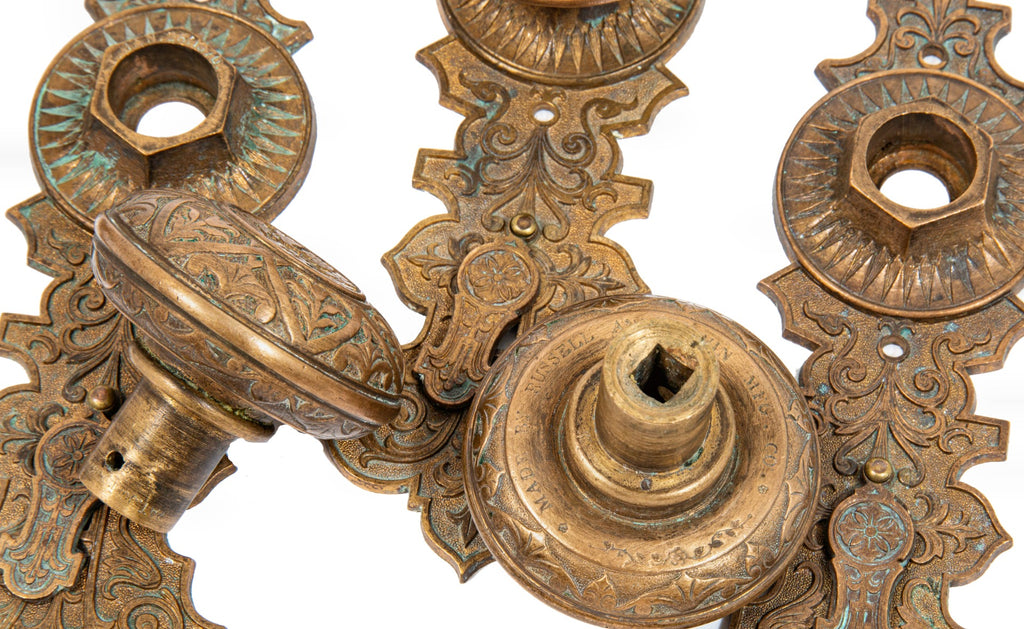 lot of original well-maintained ornamental cast bronze mccc/re matching doorknobs and backplates with swinging keyhole covers