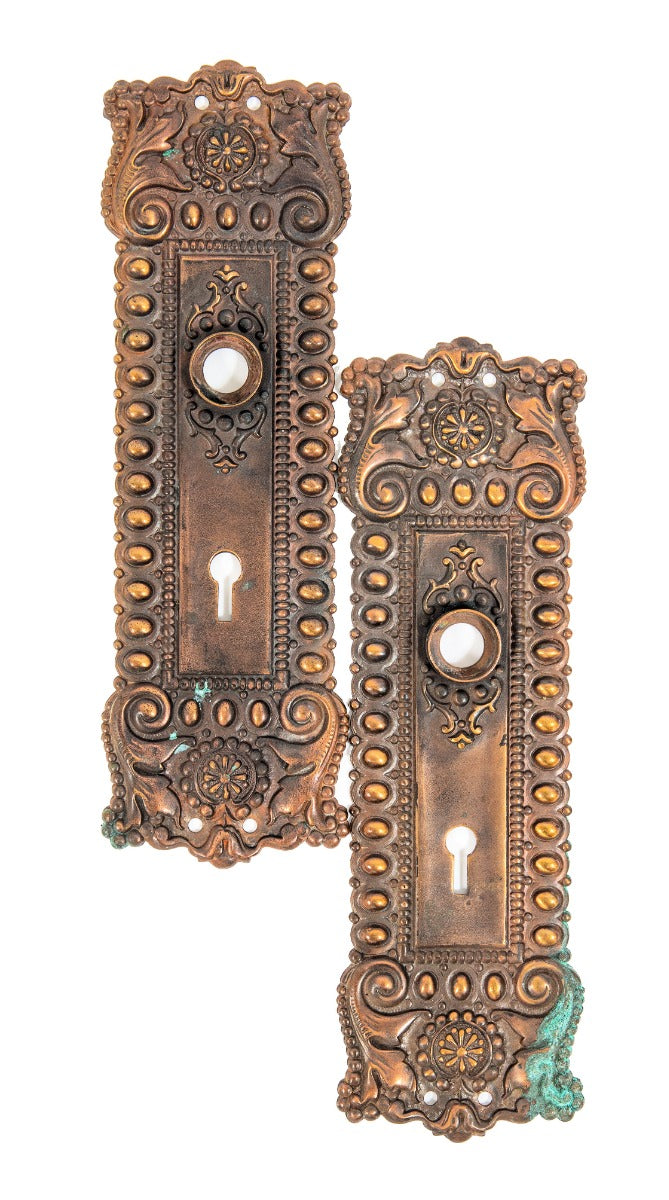 two matching all original late 1890s ornamental wrought bronze salvaged chicago doorknob backplates