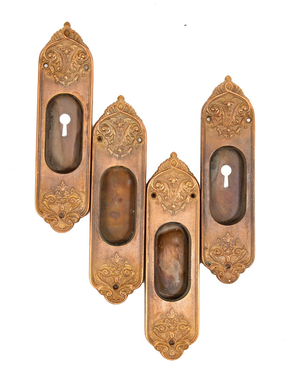 four matching late 19th century or early 20th century ornamental cast bronze salvaged chicago pocket door backplates