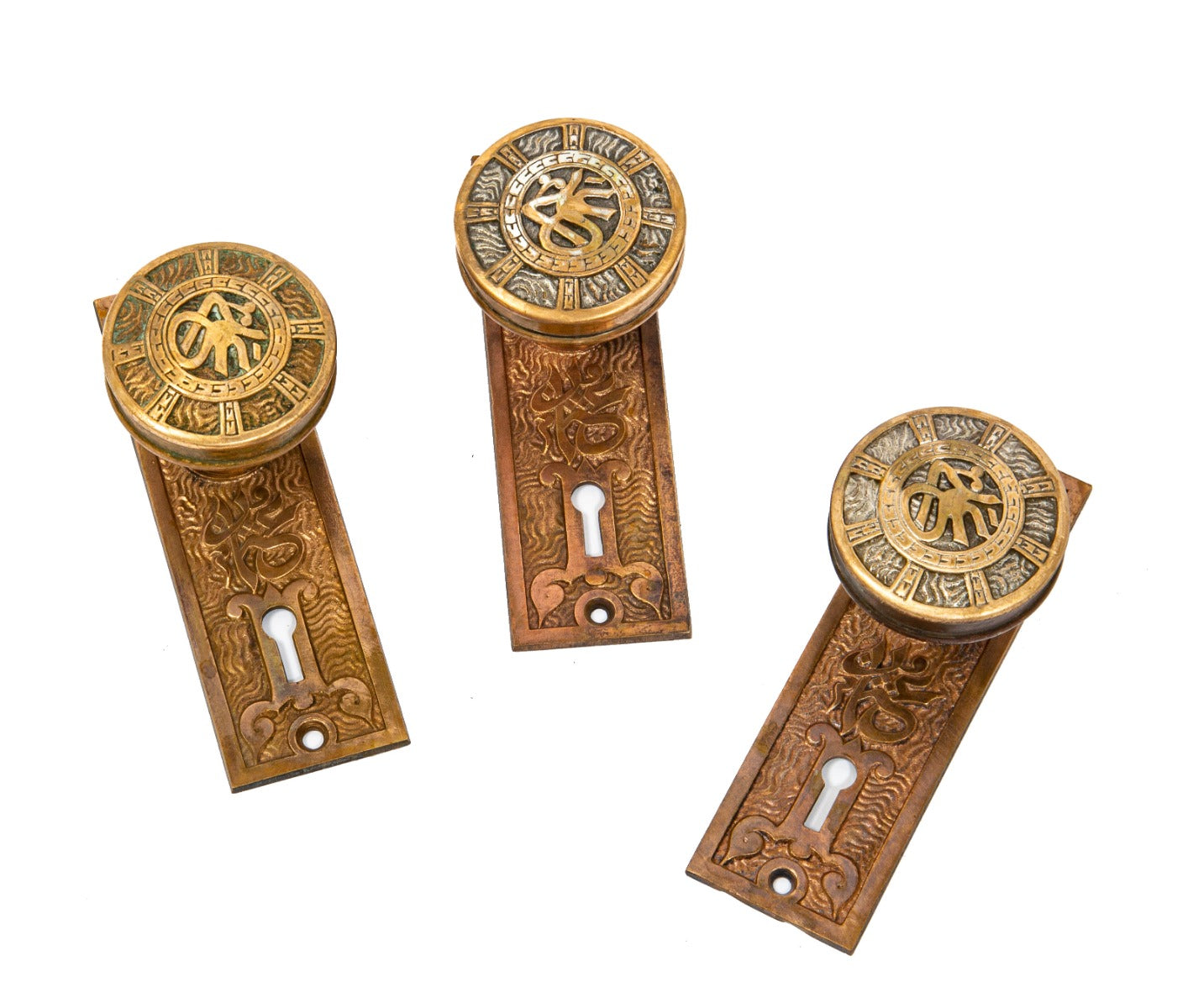 group of three matching original 19th century ornamental cast brass "arabic" pattern passage door hardware