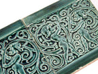 TWO matching original hard to find seagreen colored 1880s j. and j.g. low art tiles with foilage and cherubs