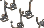 large lot of original early 20th century cast iron salvaged chicago schoolhouse hooks with acorn finials
