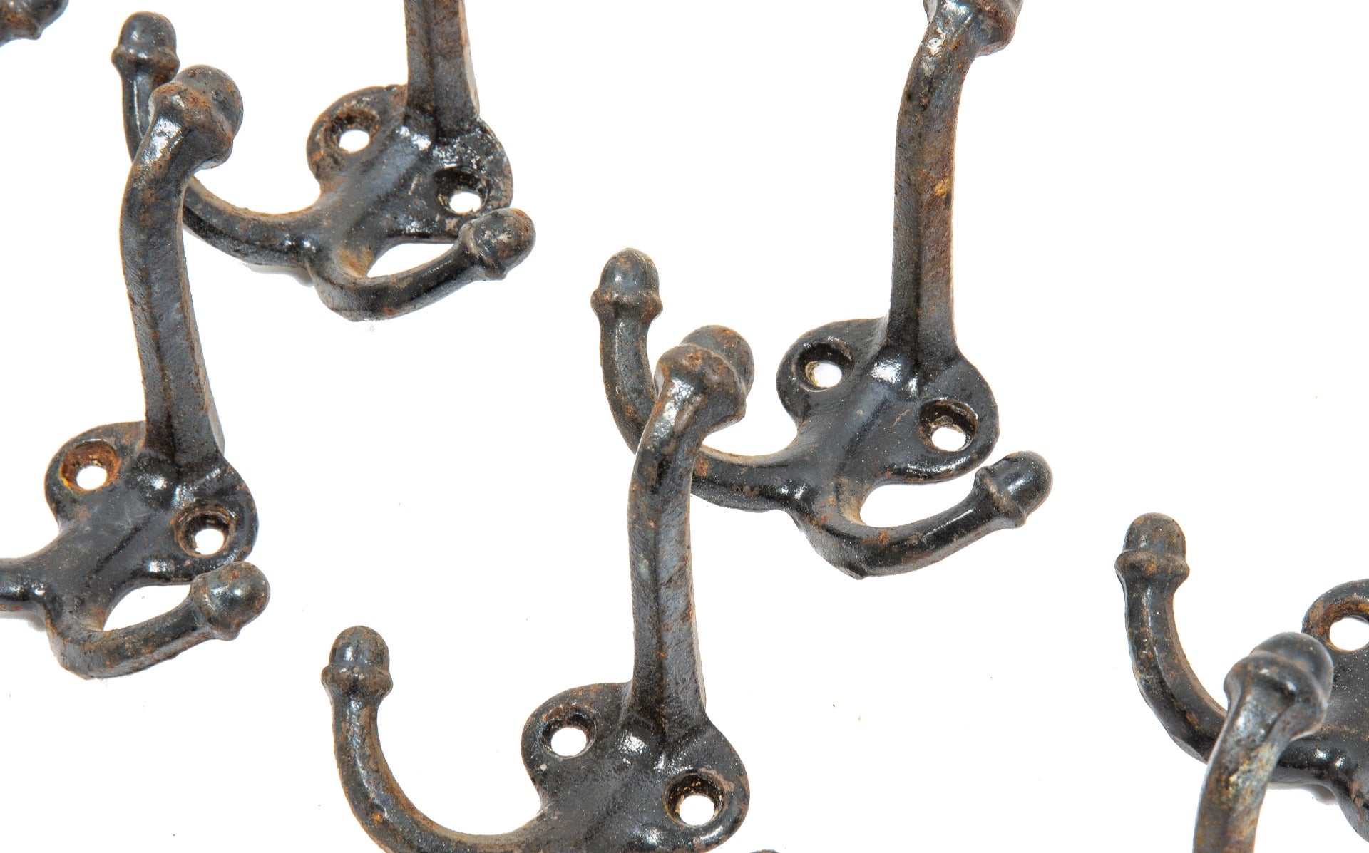large lot of original early 20th century cast iron salvaged chicago schoolhouse hooks with acorn finials