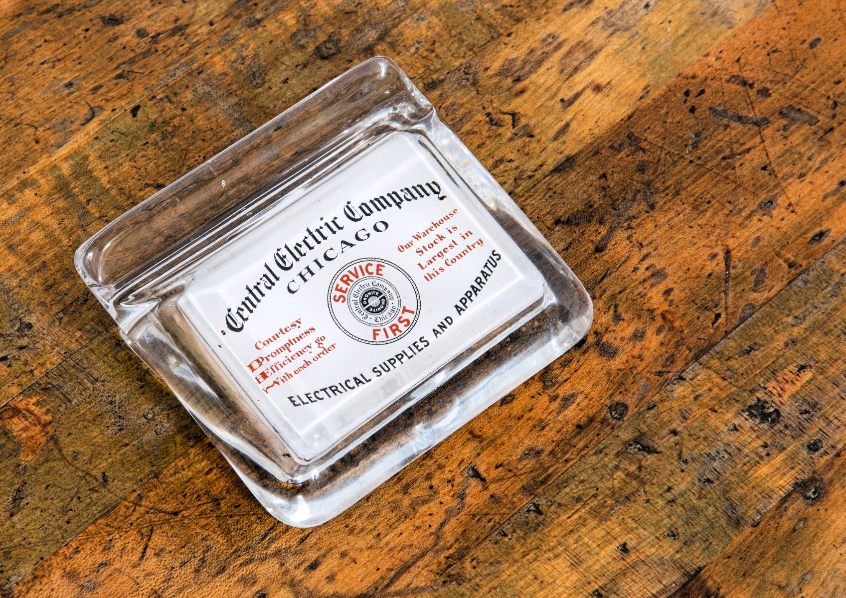 unusual early 20th century central electric company electric supply and apparatus glass paperweight with pen holder