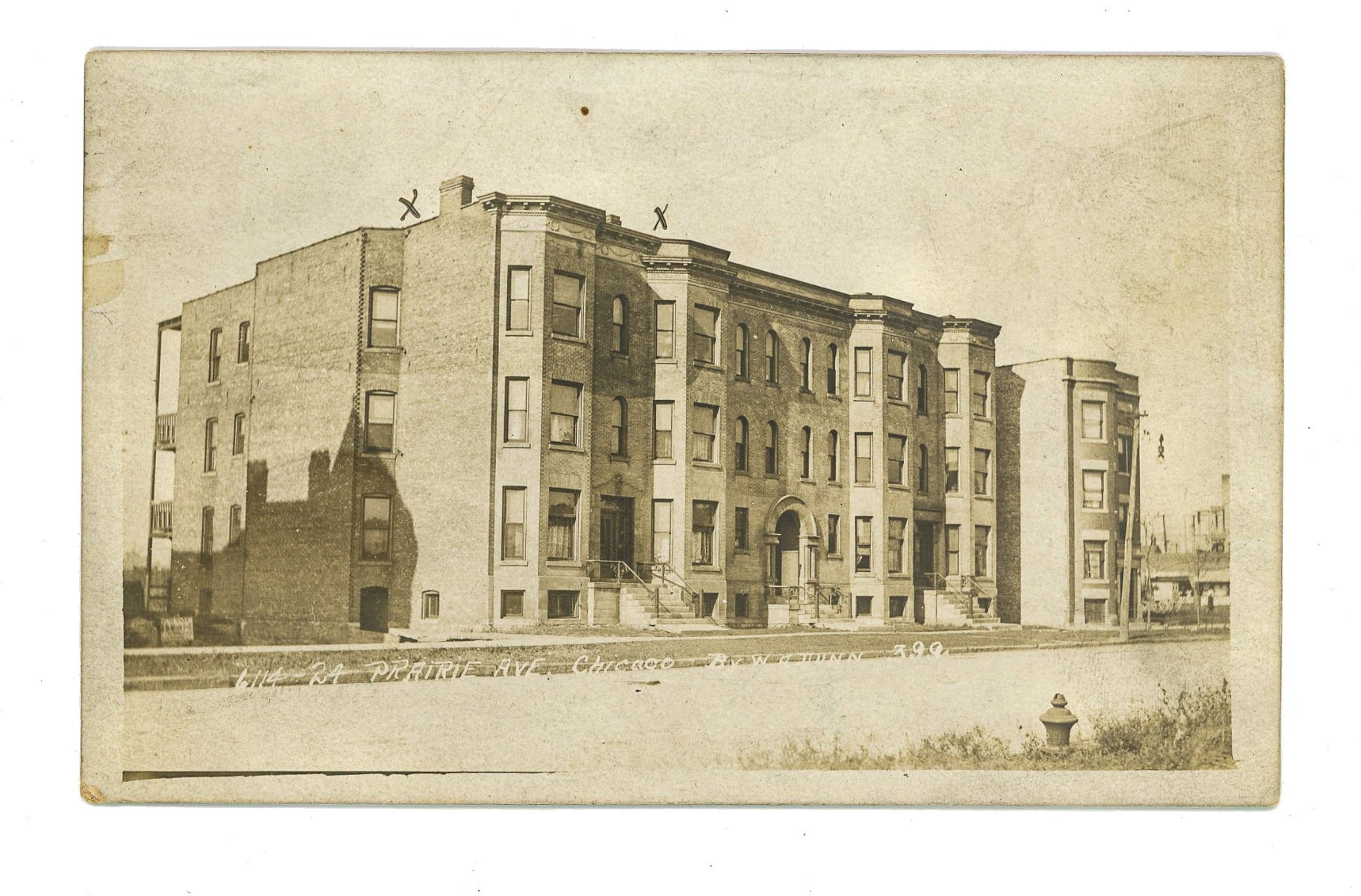 rare original real photo postcard (rppc) of a chicago rowhouse building located at 6114-24 s. prairie avenue