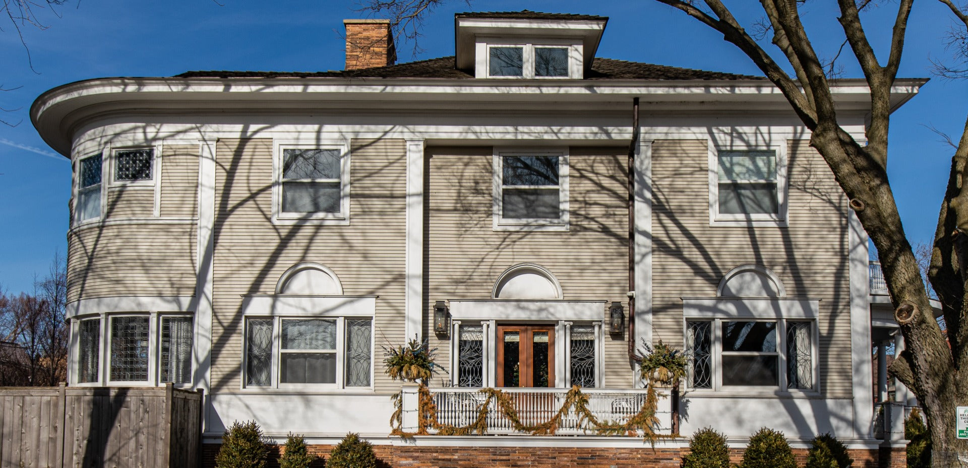 recreated frank lloyd wright-designed george blossom house exterior cream-colored fret-sawn lunette with backer board