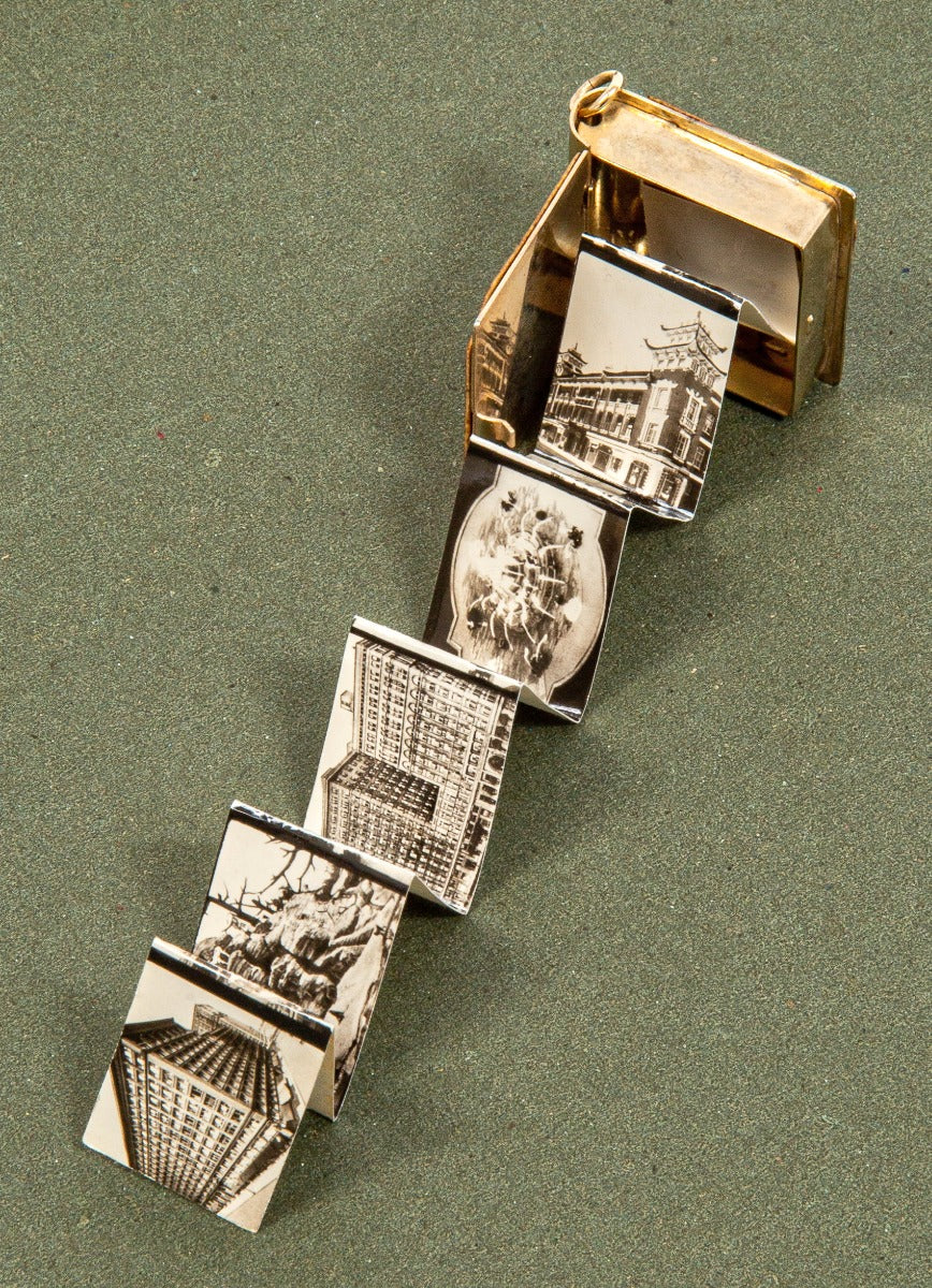 hard to find and completely intact miniature wrigley building photo album souvenir charm