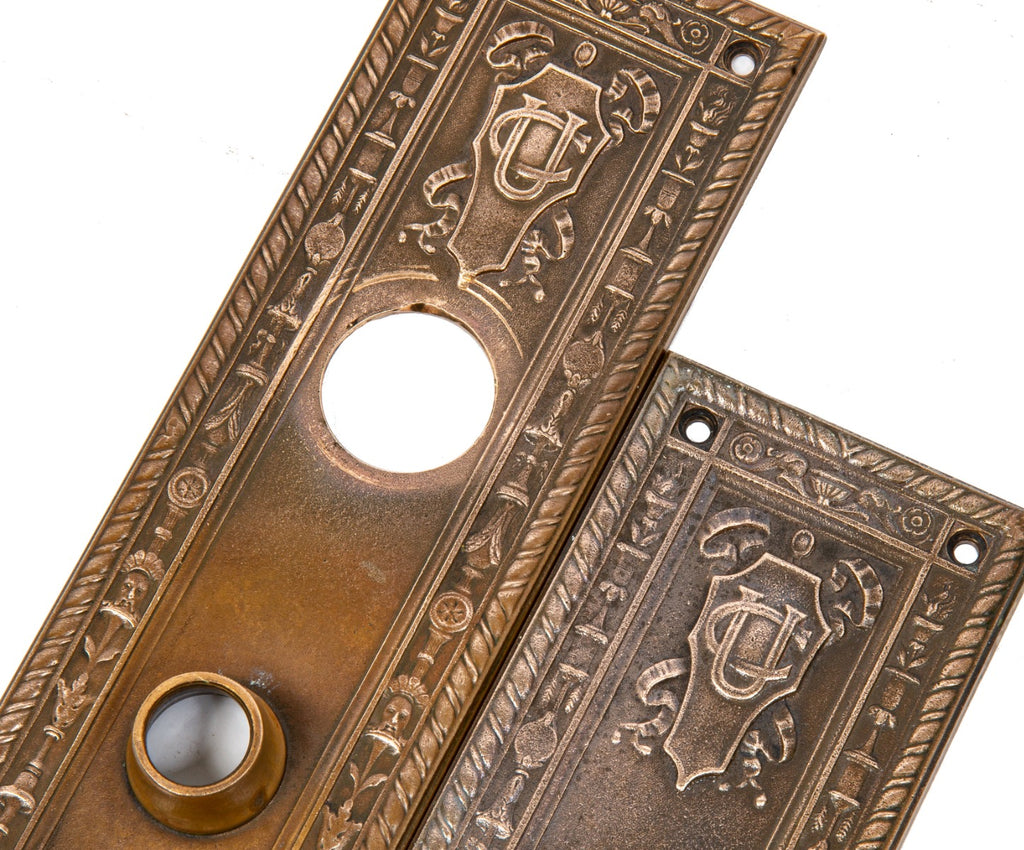 two matching cast bronze union central life insurance company building doorknob backplates designed by cass gilbert
