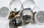 group of exceptionally rare oversized polished glass globe-shaped interior salvaged chicago doorknobs with brass shanks