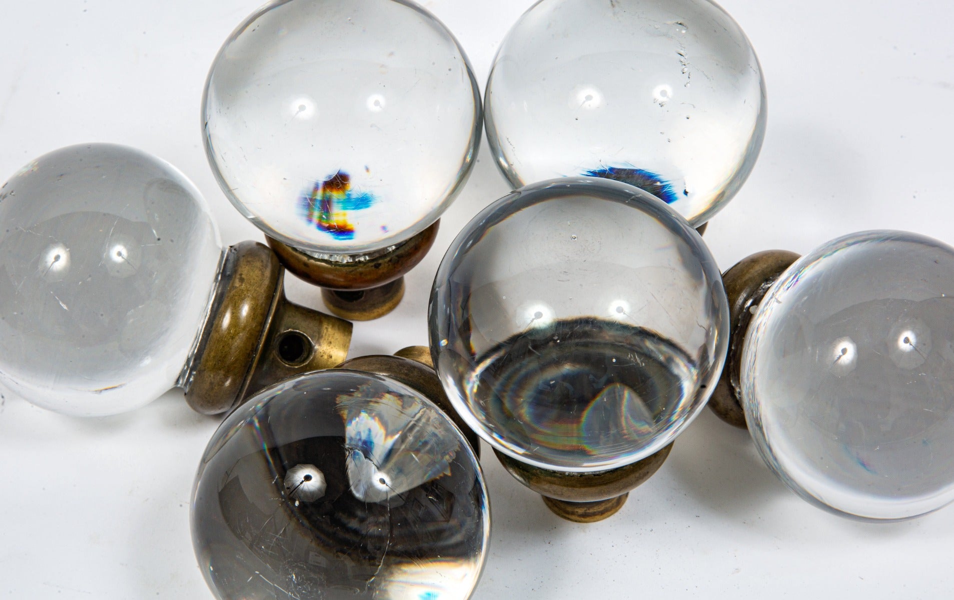 group of exceptionally rare oversized polished glass globe-shaped interior salvaged chicago doorknobs with brass shanks