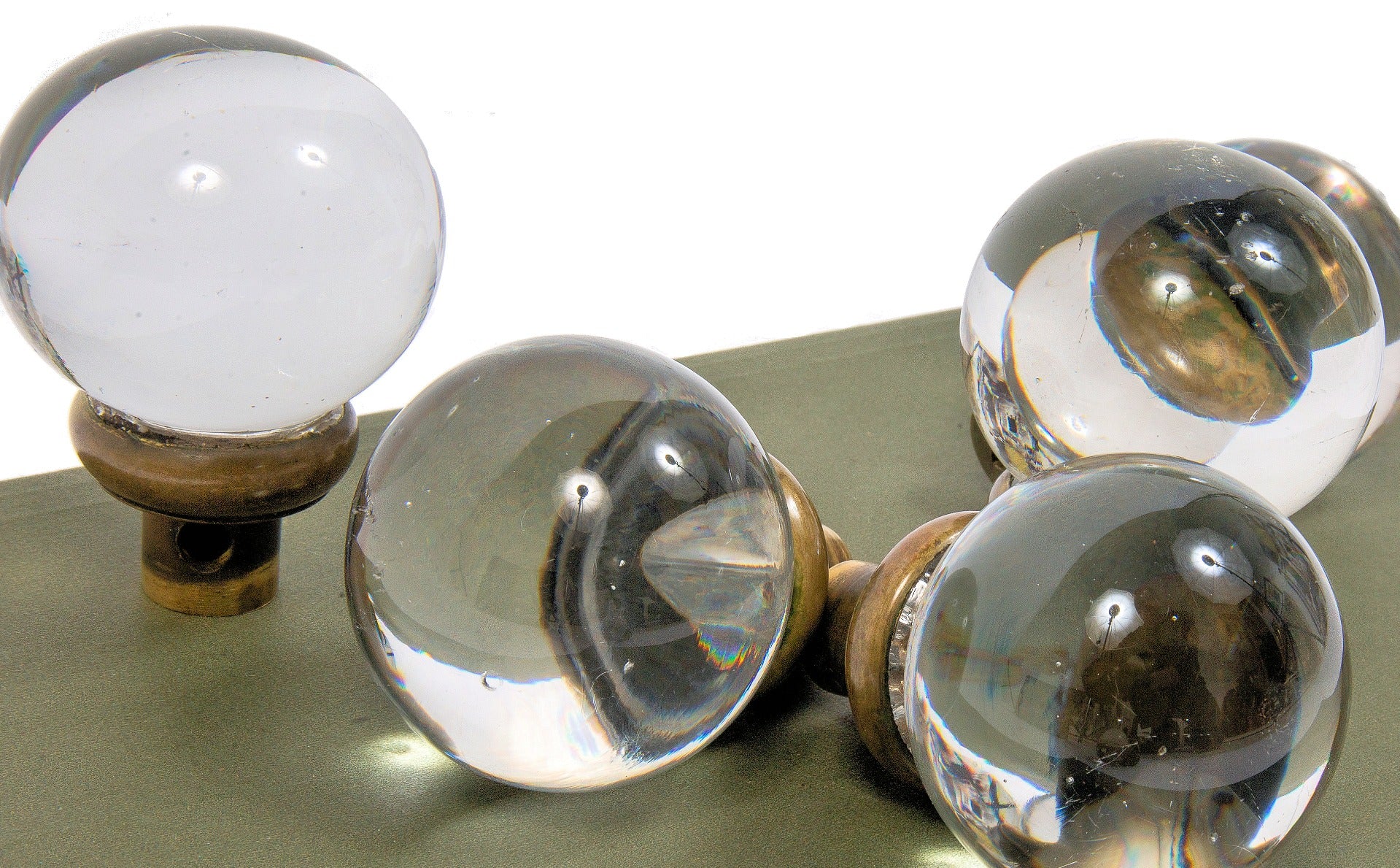 group of exceptionally rare oversized polished glass globe-shaped interior salvaged chicago doorknobs with brass shanks