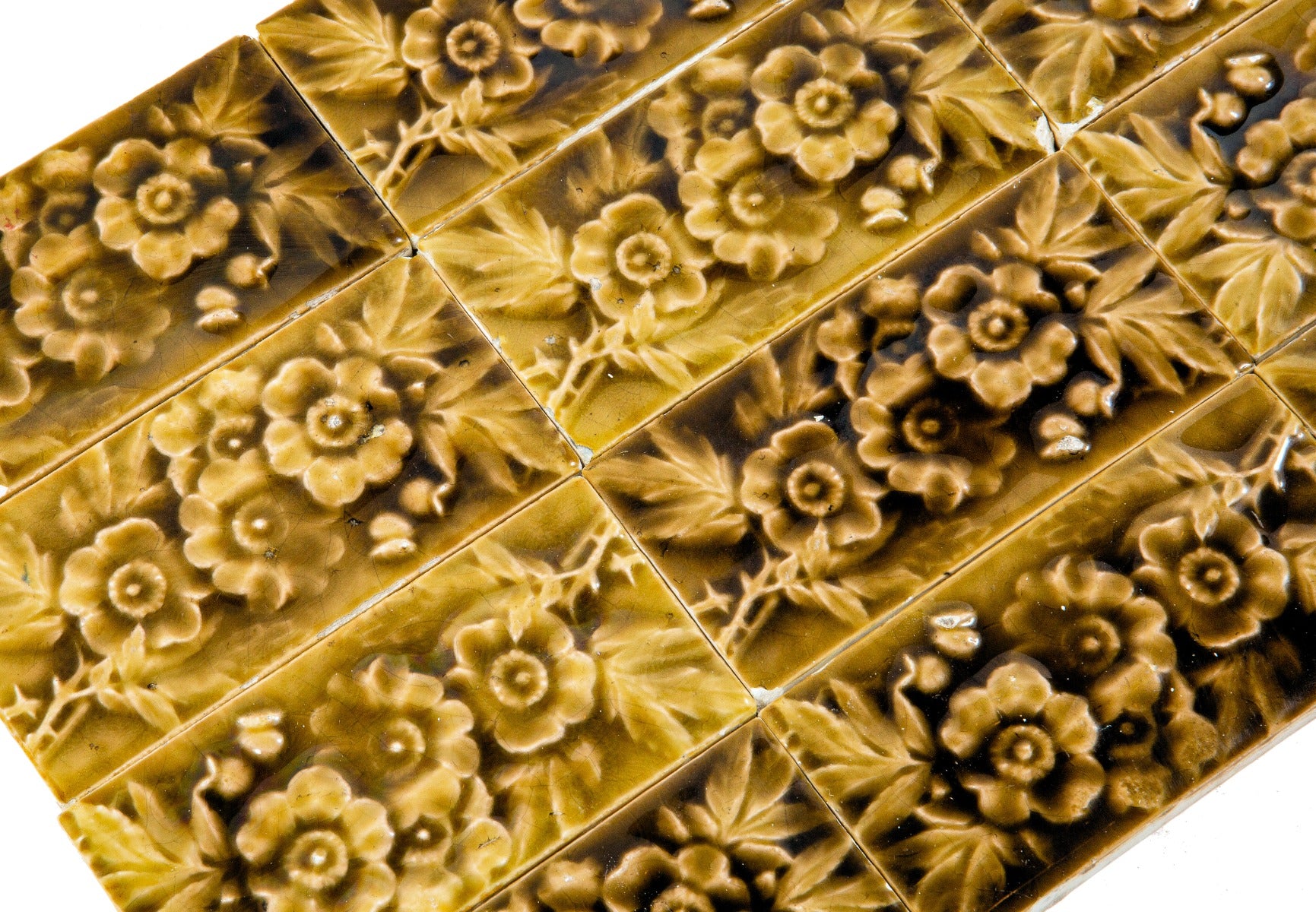 large lot of matching 19th century american victorian-era 3 x 6 inch salvaged chicago majolica tiles with floral motifs