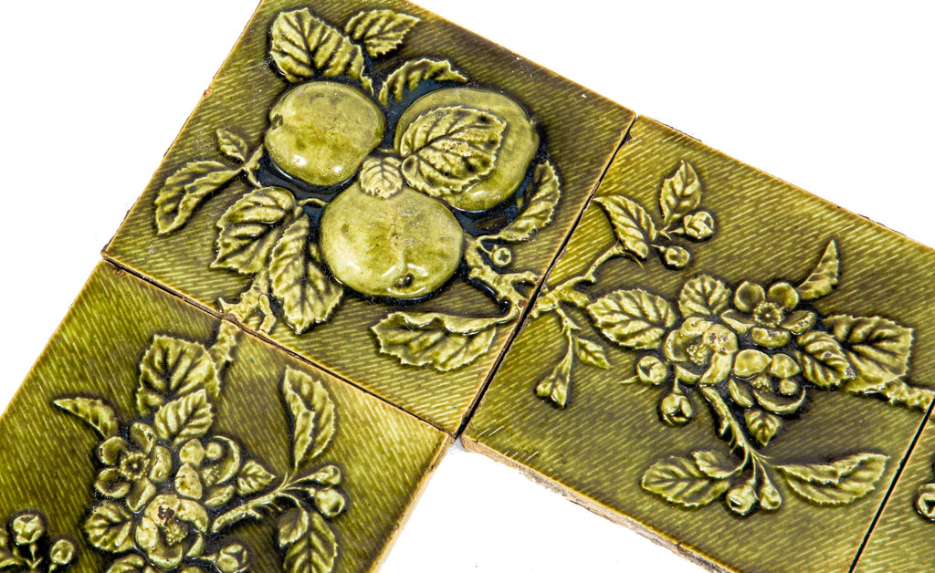 all original and amazingly intact late 1880's deeply embossed fruit and vine green majolica glazed fireplace mantel tile surround