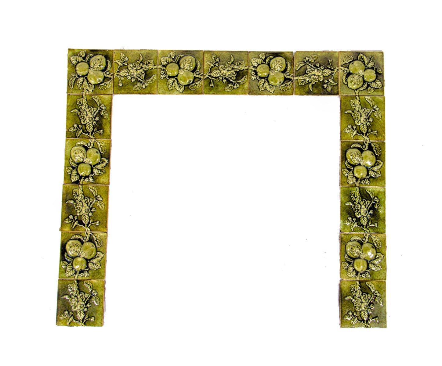all original and amazingly intact late 1880's deeply embossed fruit and vine green majolica glazed fireplace mantel tile surround