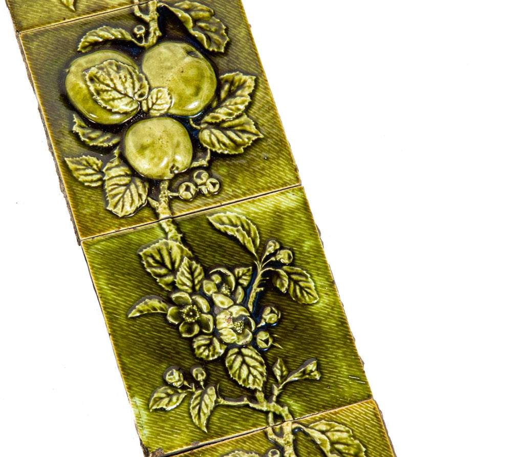 all original and amazingly intact late 1880's deeply embossed fruit and vine green majolica glazed fireplace mantel tile surround