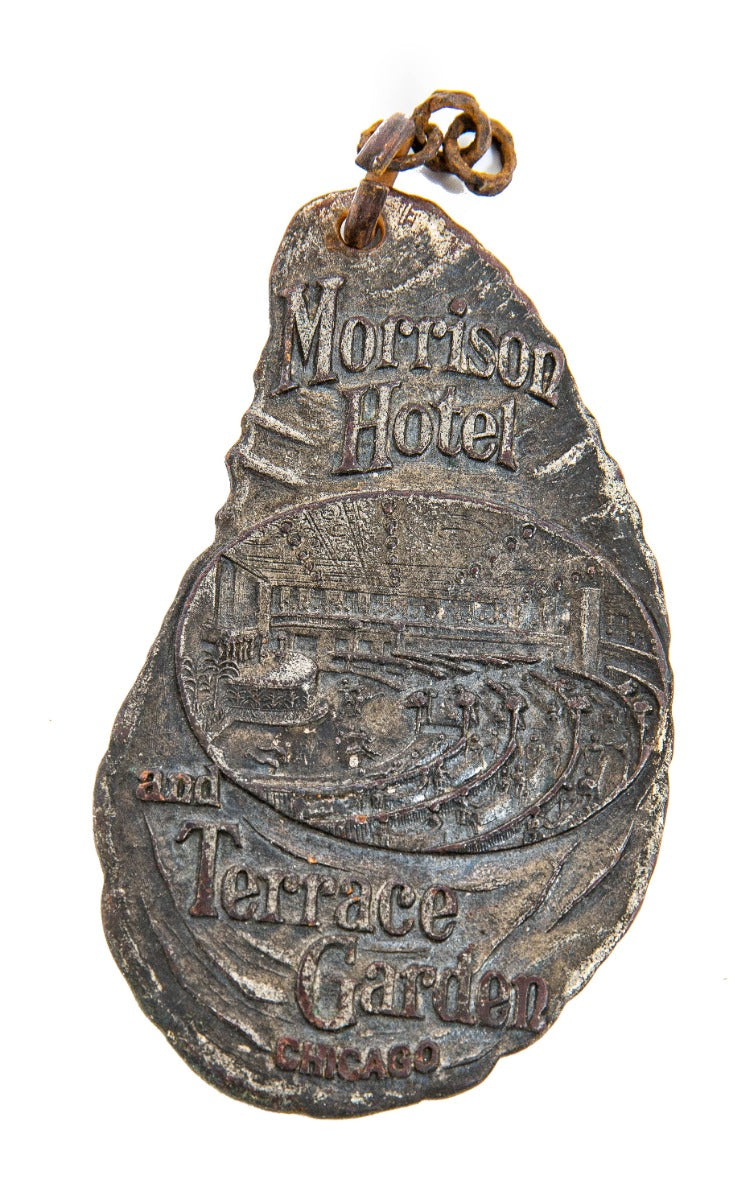 richly ornamented early 20th century original double-sided hotel morrison guest room key fob with garden terrace