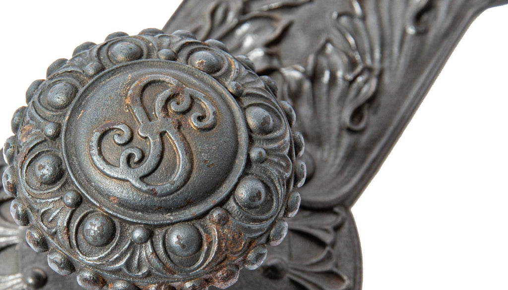 original john wellborn root-designed ornamental cast iron doorknob and matching backplate from the society for savings building