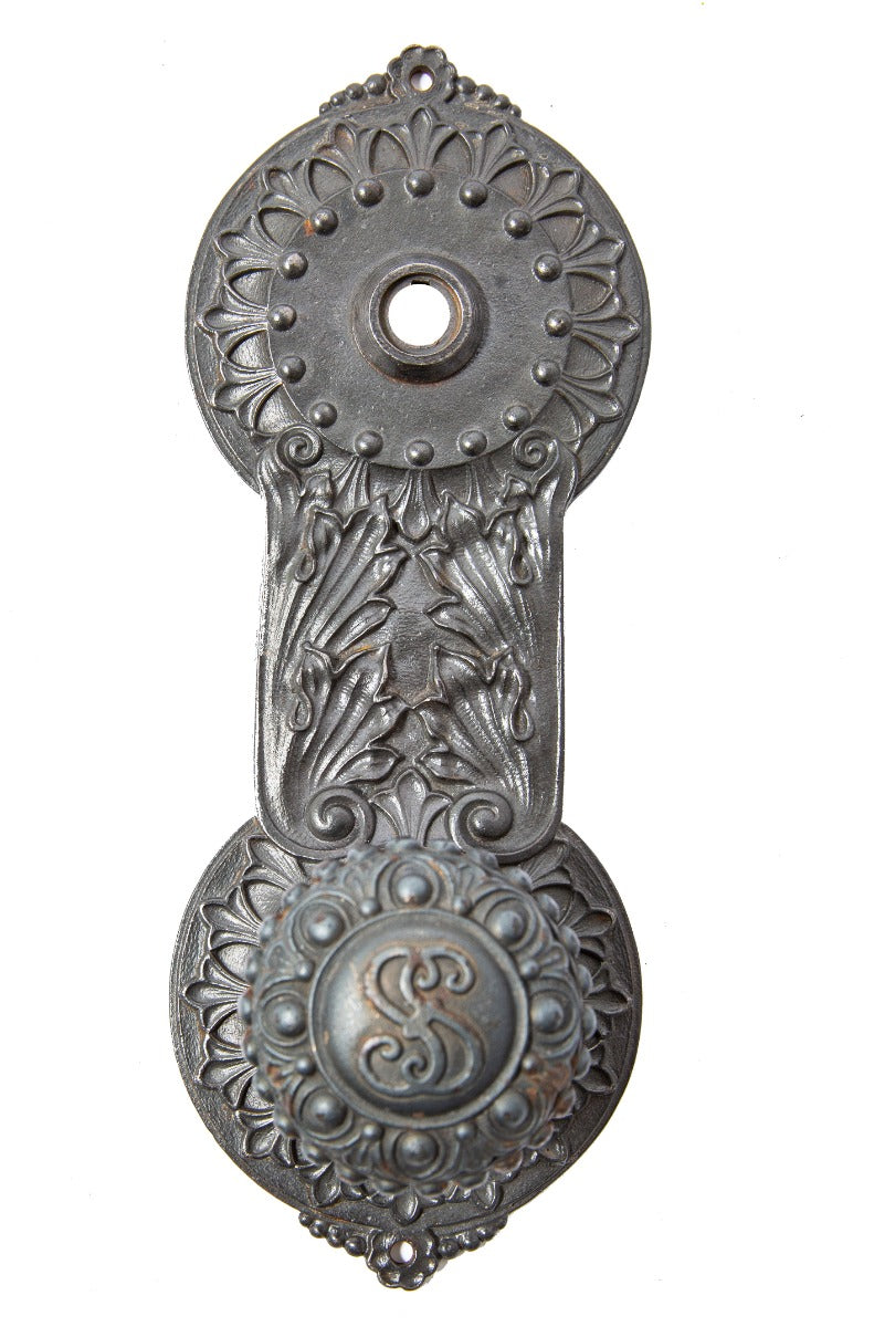 original john wellborn root-designed ornamental cast iron doorknob and matching backplate from the society for savings building