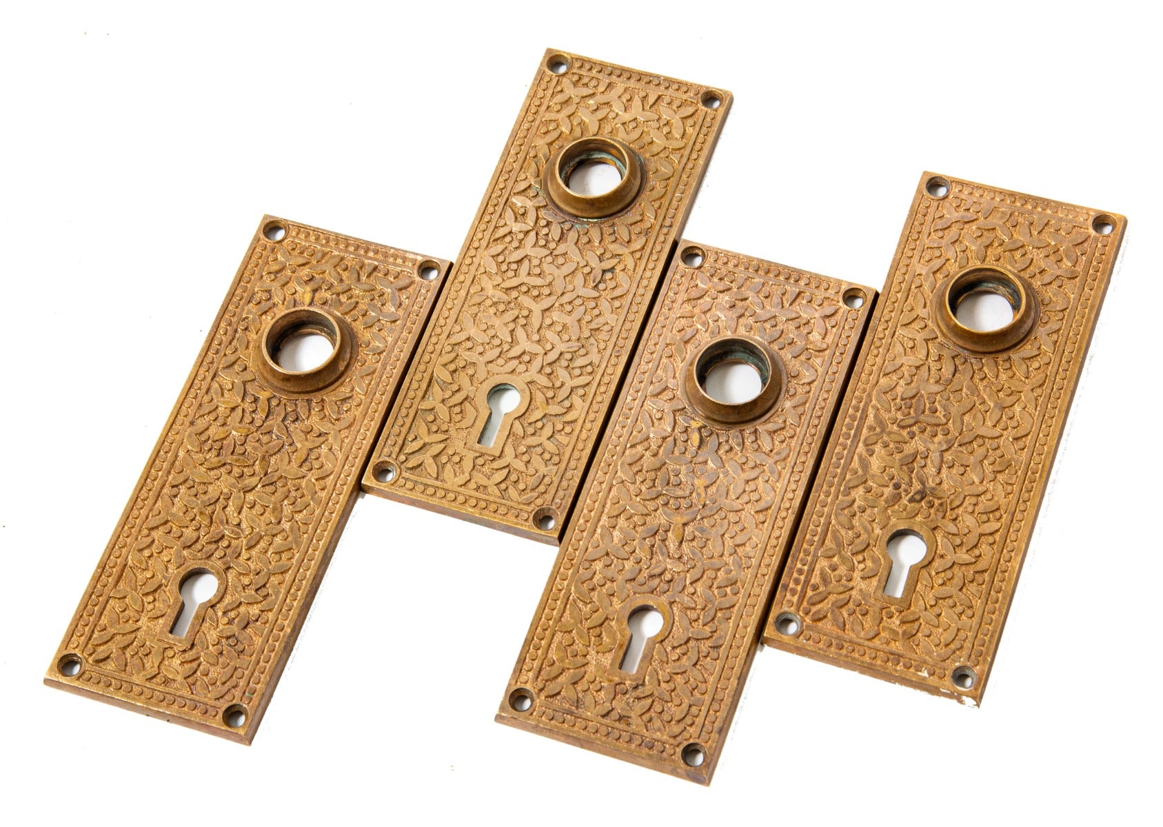group of four matching hard to find anglo-japanese style 1880s "rice" pattern salvaged chicago doorknob backplates