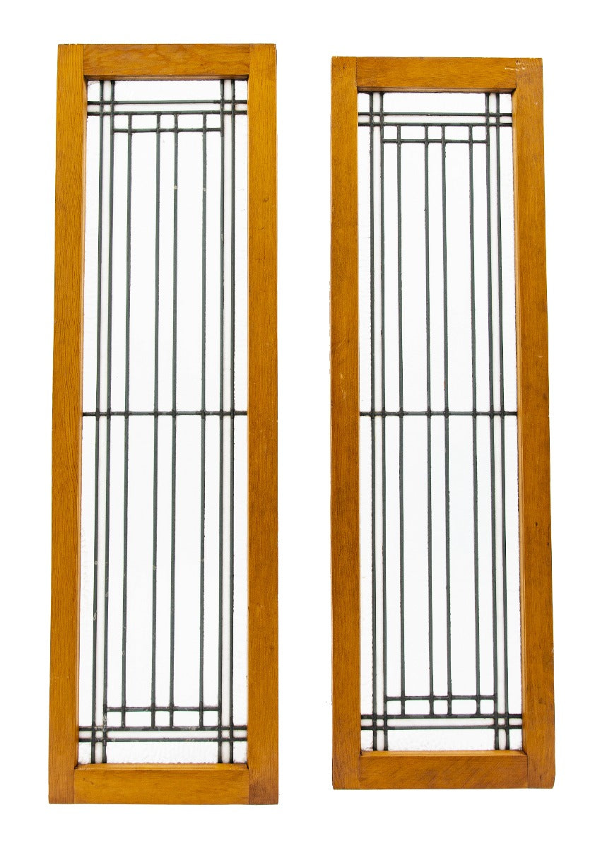 two matching early 20th century strongly geometric salvaged chicago leaded glass windows accentuated with white and cathedral roll borders