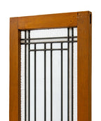 two matching early 20th century strongly geometric salvaged chicago leaded glass windows accentuated with white and cathedral roll borders