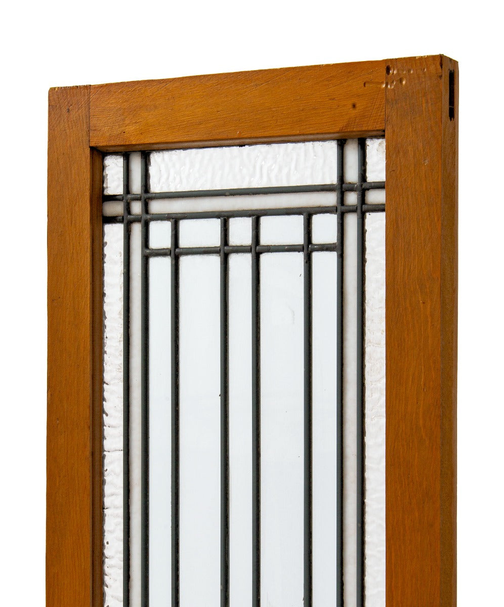 two matching early 20th century strongly geometric salvaged chicago leaded glass windows accentuated with white and cathedral roll borders