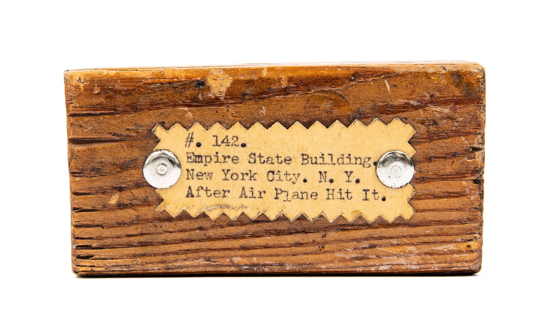 original labeled new york city empire city building fragment salvaged in 1945 after struck by b-25 plane