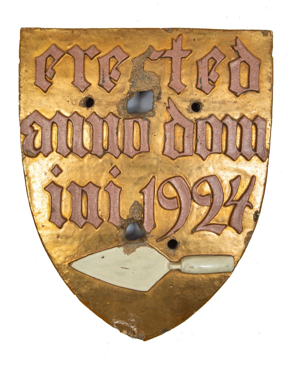 c. 1920's 24-karat gold glazed ornamental terra cotta r.r. donnelley printing plant exterior facade shield with hand trowel