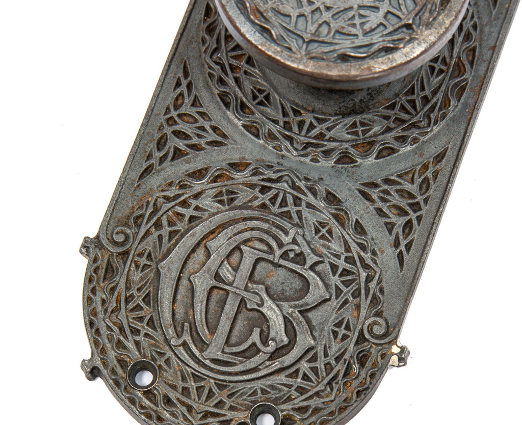 original louis h. sullivan-designed ornamental cast iron chicago stock exchange monogrammed backplate with matching doorknob