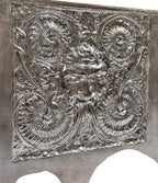 visually distinctive ornamental cast iron figural victorian-era 19th century cast iron fireback with brushed metal finish