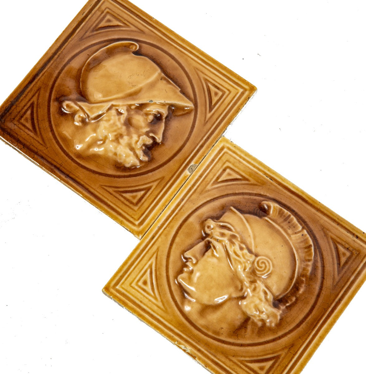 two hard to find salvaged chicago original late 1880s j. & j.g. low art fireplace tiles featuring greek or roman soldiers