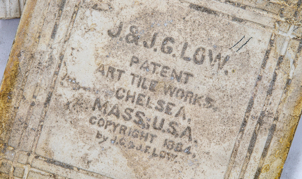 two hard to find salvaged chicago original late 1880s j. & j.g. low art fireplace tiles featuring greek or roman soldiers