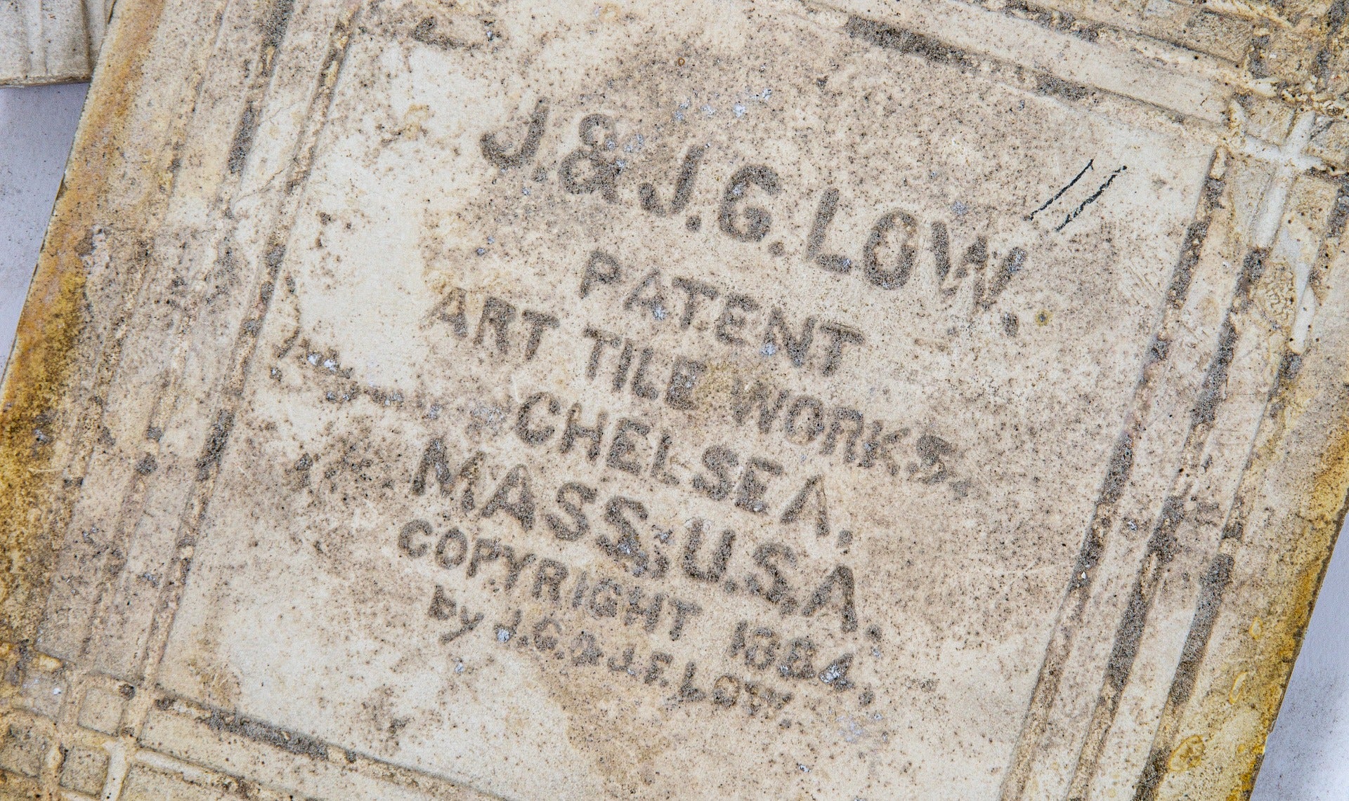 two hard to find salvaged chicago original late 1880s j. & j.g. low art fireplace tiles featuring greek or roman soldiers