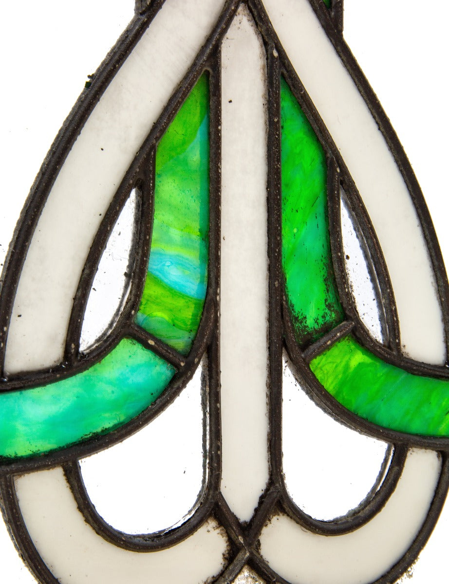 richly colored original early 20th century amerian art nouveau style leaded glass window with wood sash frame