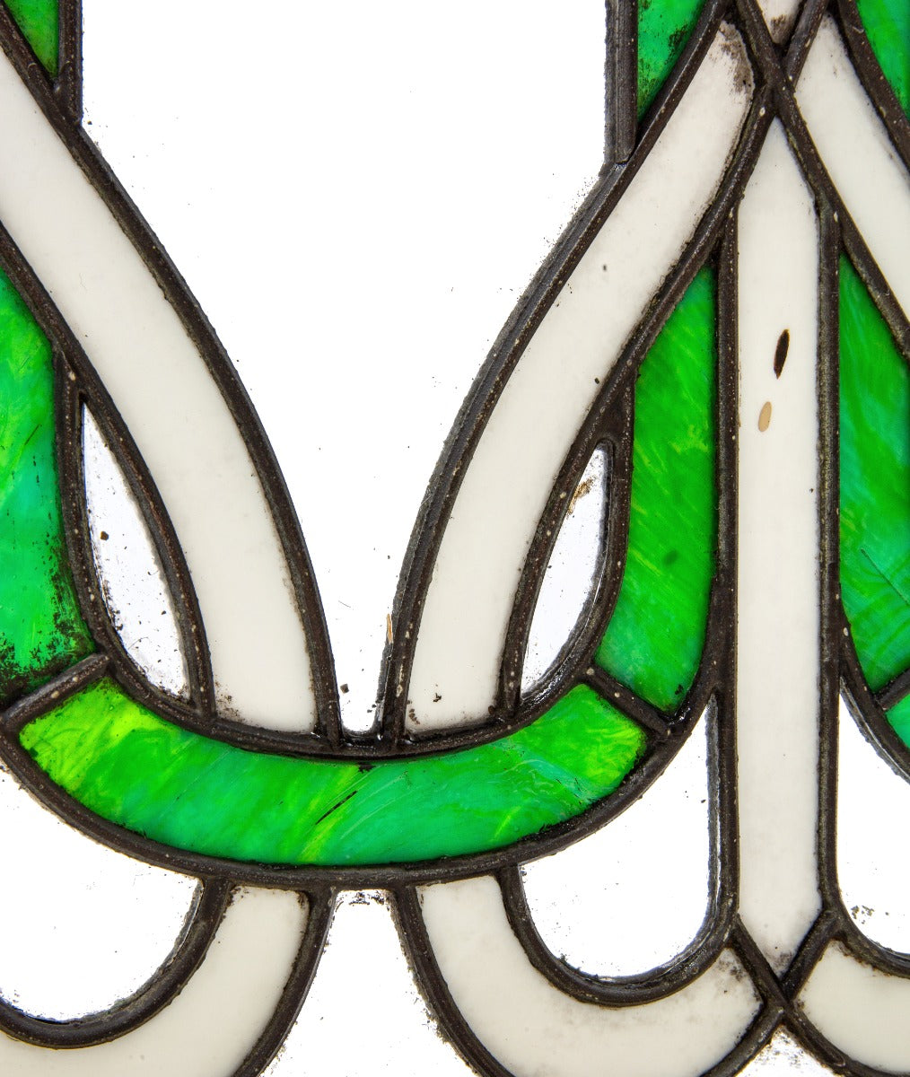 richly colored original early 20th century amerian art nouveau style leaded glass window with wood sash frame