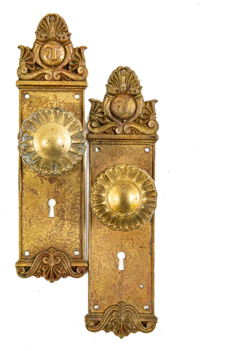 matching set of custom-designed cast brass chicago tribune building passage door backplates and knobs