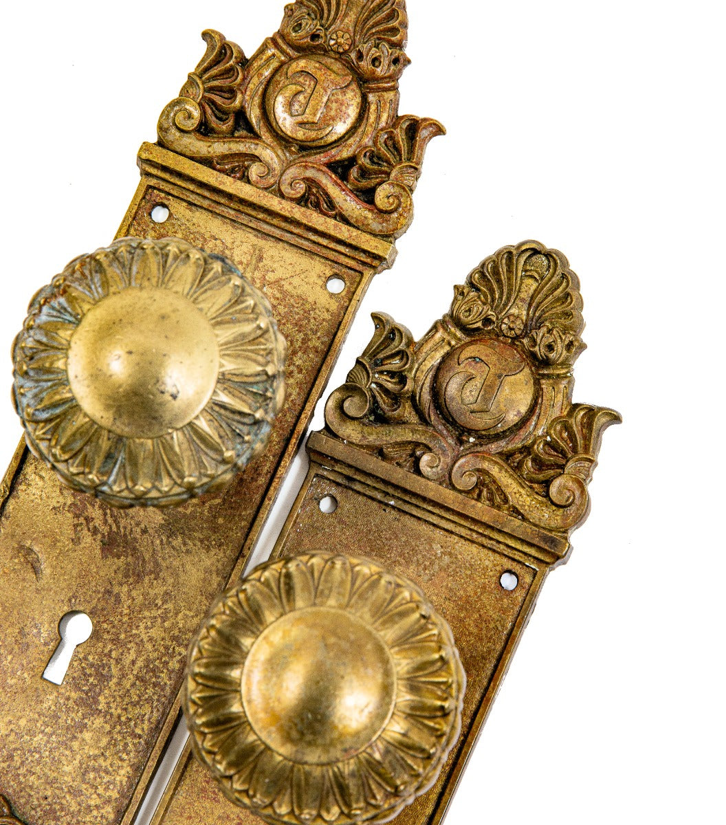 matching set of custom-designed cast brass chicago tribune building passage door backplates and knobs