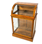 original 19th or early 20th century refinished oak wood freestranding display case with bent glass top and bottom cabinet with shelf