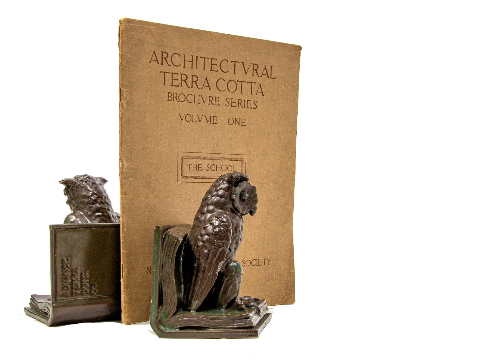 one of two very rare all original and richly colored advance terra cotta owl bookend salesman sample
