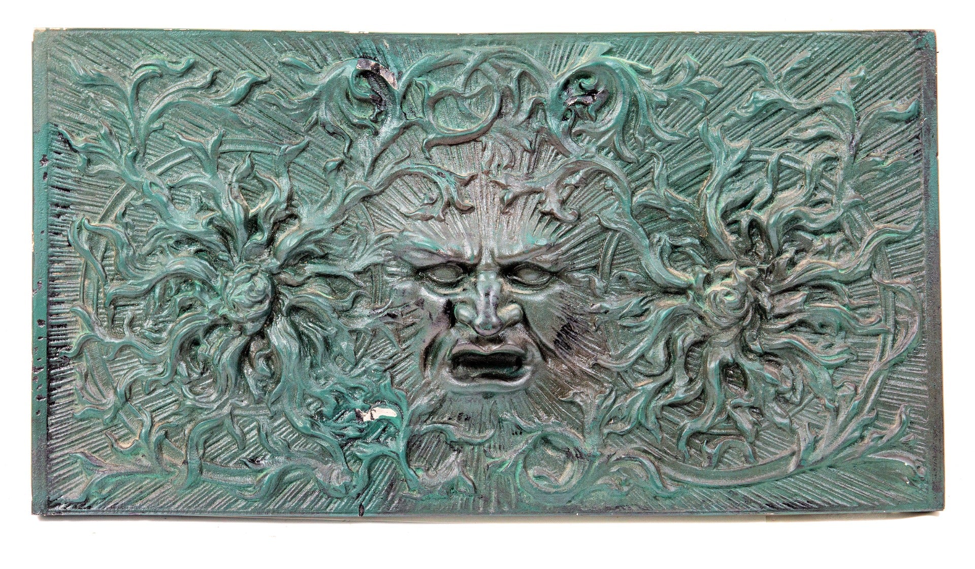 unusual painted green recast of a 19th century american victorian-era fireplace fireback with centrally located  "green man"