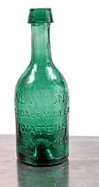 hard to find mid-nineteenth century vibrant green glass soda bottle fabricated for new york bottler thomas newton