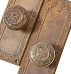 two matching original custom-designed cast bronze monogrammed new york city woolworth building doorknobs and backplates