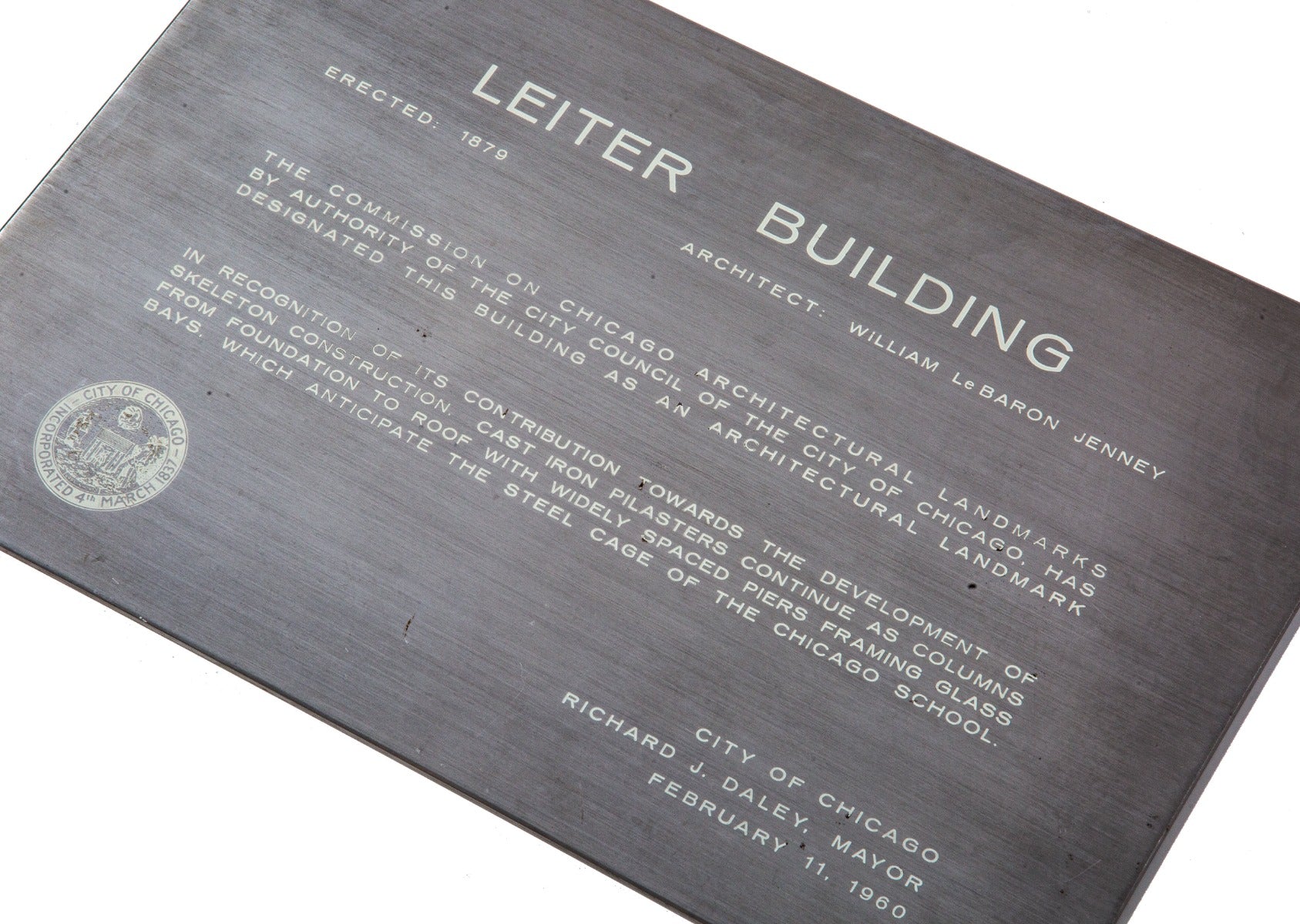 rare 1960 skidmore, owings, and merrill-designed stainless steel chicago architectural landmarks building plaque for william le baron jenney's leiter building