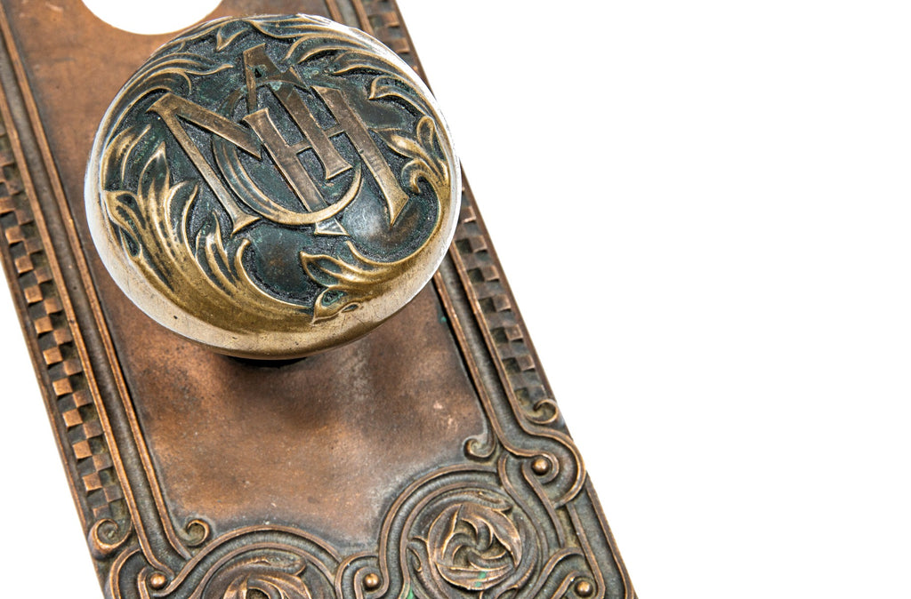 19th century custom-designed richardsonian romanesque cast bronze minneapolis city hall monogrammed doorknob and backplate